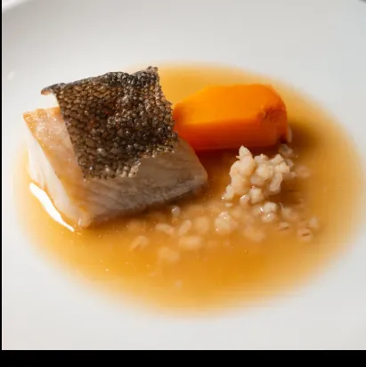 Roasted fish in broth with squash