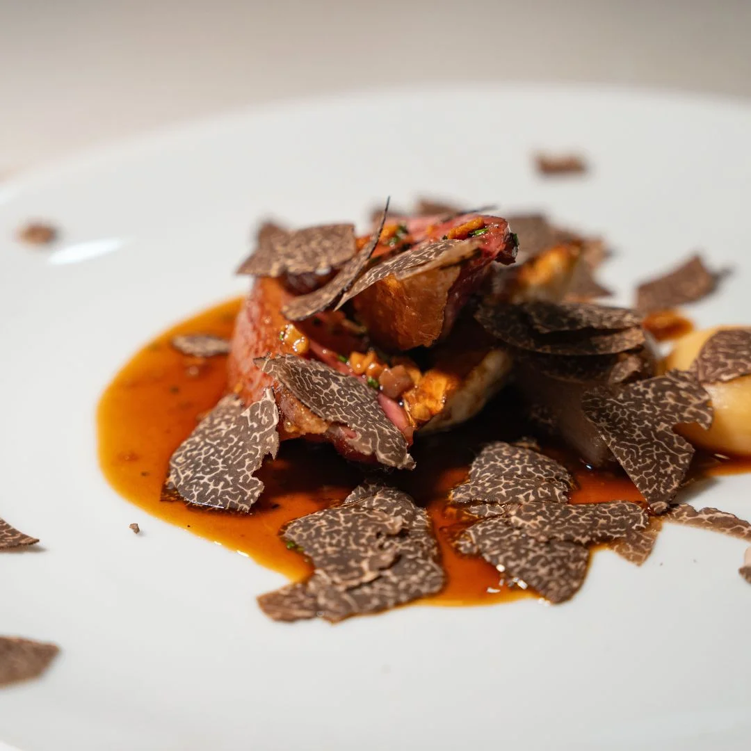 Duck topped with shaved black truffle